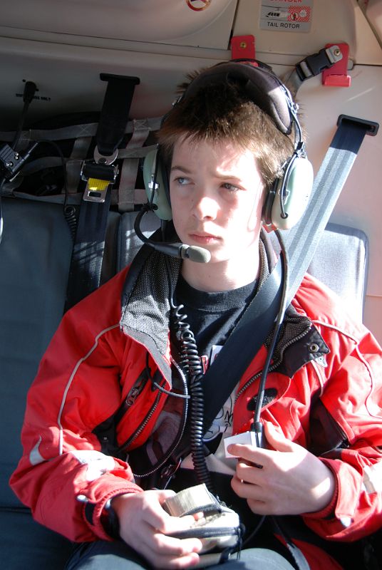 02 Peter Ryan In Helicopter As It Takes Off From Canmore Towards Mount Assiniboine In Winter